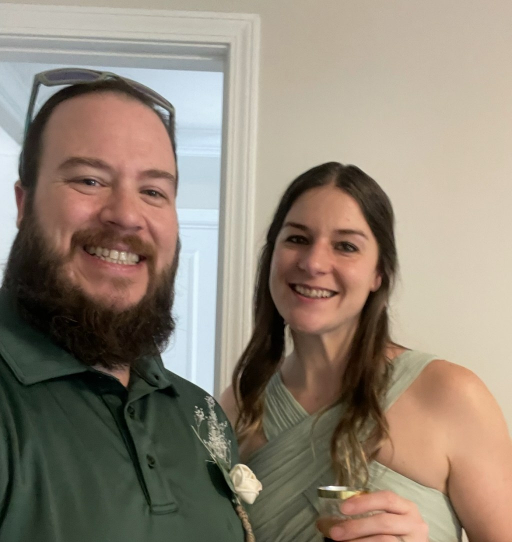 Luke and Naomi dressed up for their best friends' wedding