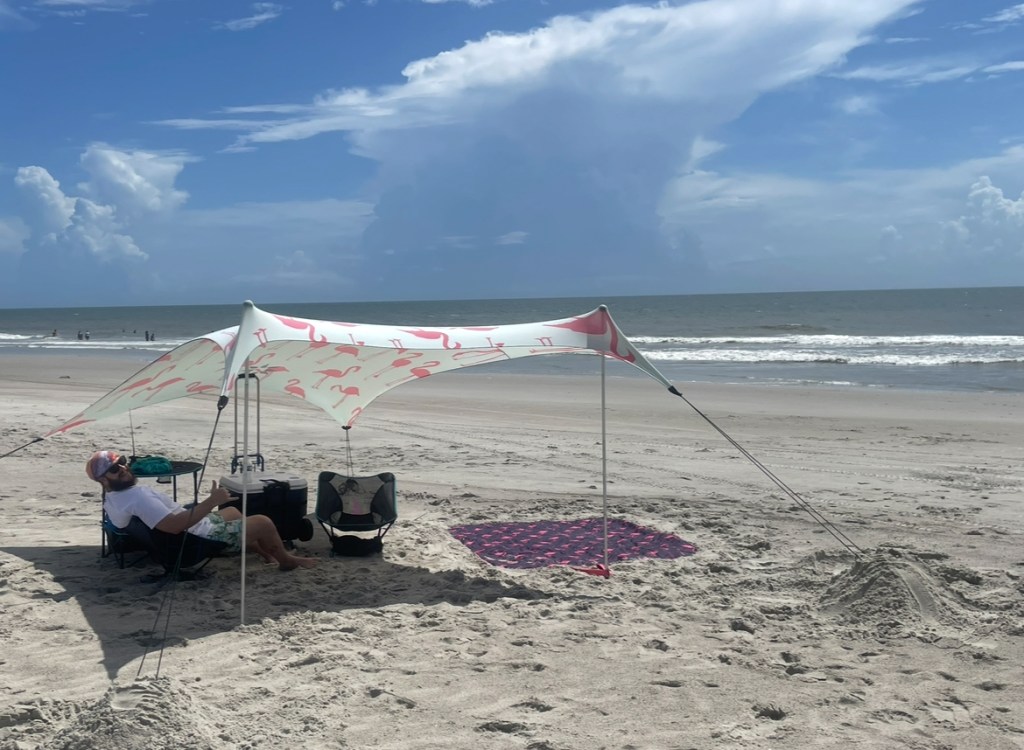 Luke under his shade at Fort Fisher Beach