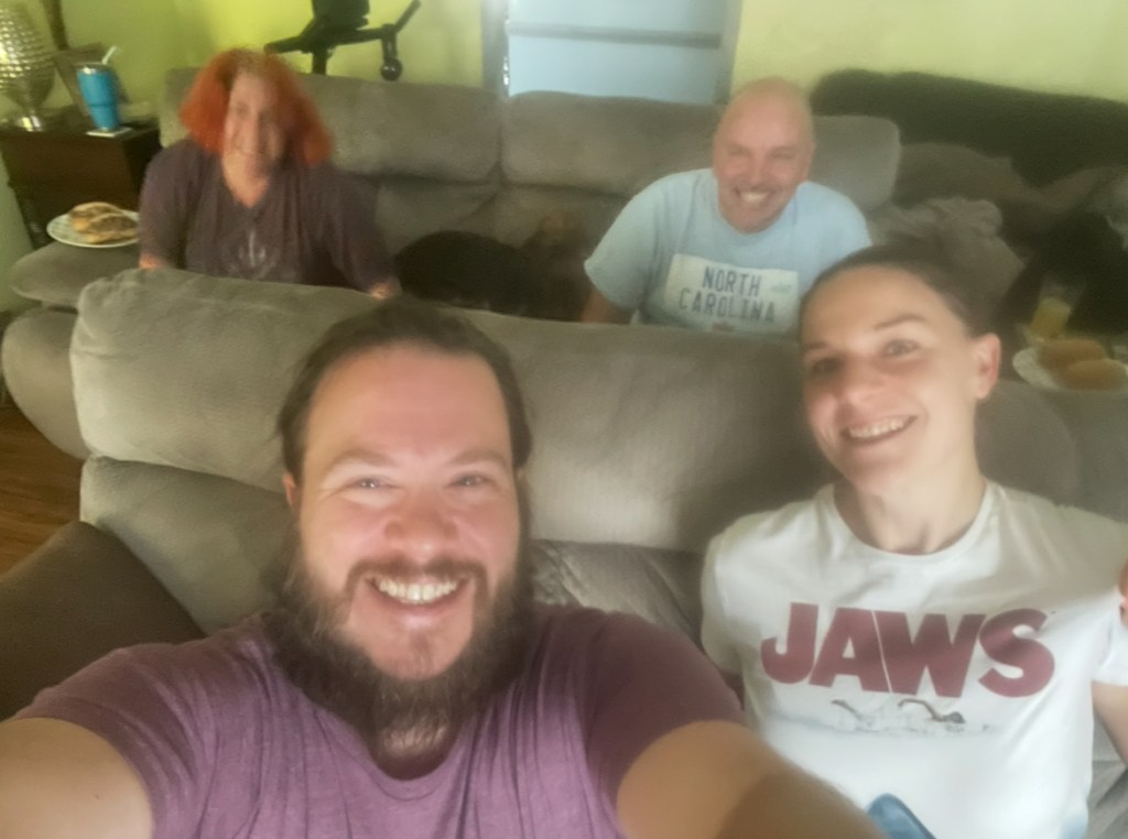 Naomi and Luke at their friends' Tom and Jenn's house to watch Jaws. Naomi wearing a Jaws shirt