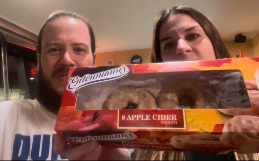 Luke and Naomi at Fermental with a box of apple cider donuts
