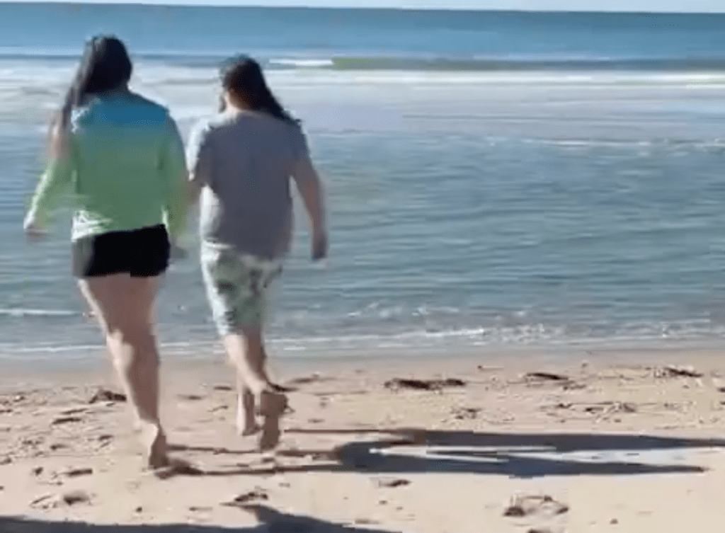 Luke and Naomi Heading into the Ocean for their Not So Polar Plunge 2026